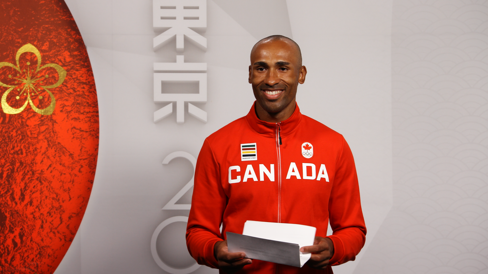 Canada's Flag Bearer Damian Warner receives a letter from ...