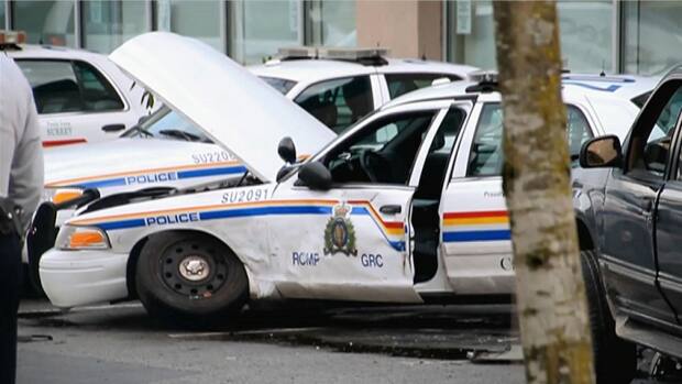 2 Surrey Cops Injured By Driver In RCMP Parking Lot | CBC News