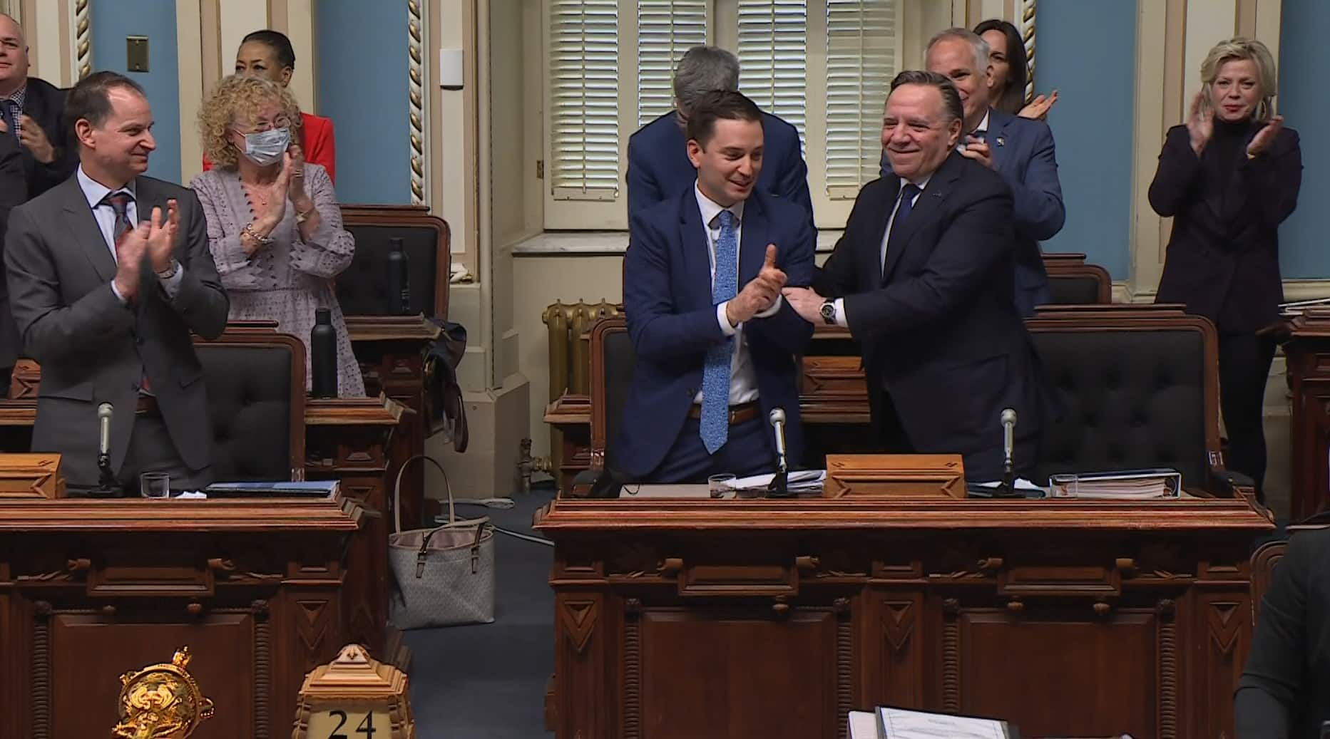 caq-members-celebrate-as-bill-96-is-voted-on-and-adopted-at-quebec-s