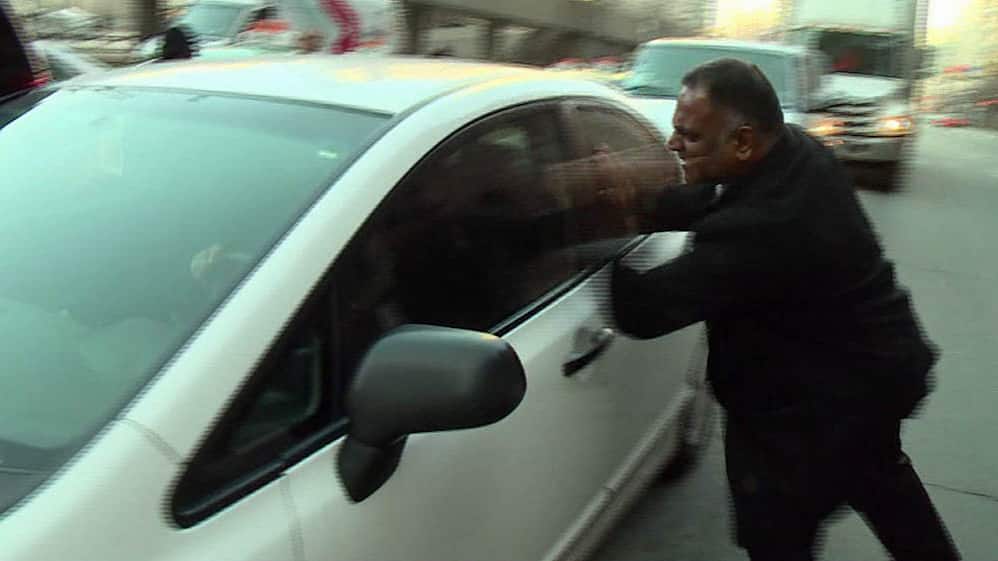 angry taxi driver confronts uber driver cbc news